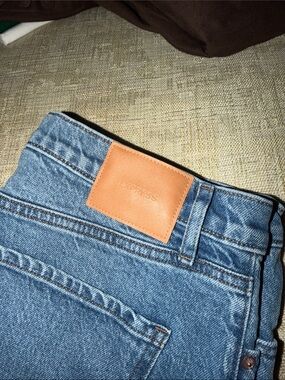 Express Men’s Blue Denim Jeans with Tan Leather Patch